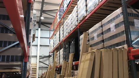 Boxes,-pallets-and-crates-stacked-up-in-a-warehouse