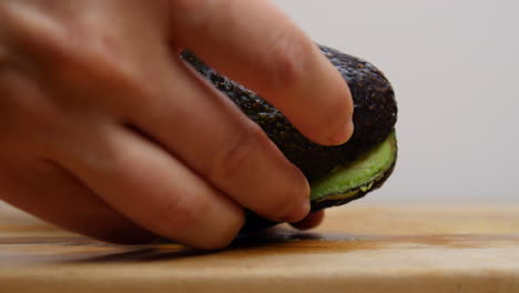 Cutting-open-an-avocado-with-a-knife