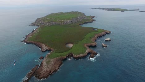 Aerial-wide-drone-shot-of-the-Isla-Redonda-with-the-famous-hidden-beach,-Marietas-Islands,-Nayarit,-Mexico