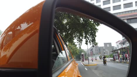 Xian,-China---August-2019-:-Car-mirror-view-of-the-traffic-on-busy-street-in-the-city-of-Xian-in-summer,-Shaanxi-Province