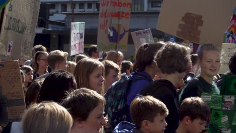 Fridays-for-Future-activists-holding-up-signs,-Cologne