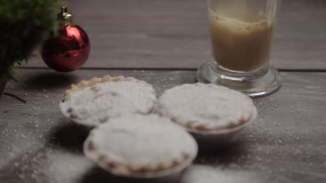 Mince-pies-and-serving-of-coffee-in-Christmas-background
