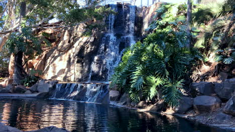 Waterfall-flowing-into-peaceful-green-pond,-Toowoomba-Queensland