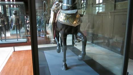 Close-up-shot-of-a-statue-of-a-Knight-with-armor-riding-a-horse,-in-the-Army-Museum,-Paris,-France