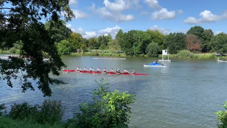 Oarsman-rowing-team-eight-is-rowing-over-the-lake-on-a-sunny-day-in-Muenster,-Germany