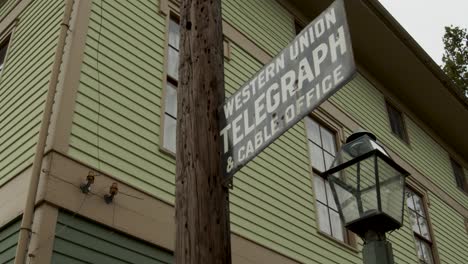 Old-telegraph-line-with-Western-Union-period-sign-in-early-American-historical-village