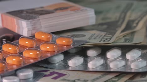 Close-Shot-of-Different-Currencies-and-Prescription-Drugs