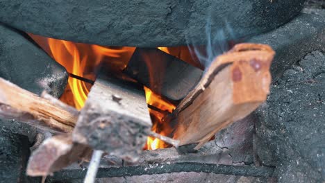 Close-Shot-of-a-Cooking-Pot-on-a-Wood-Fire