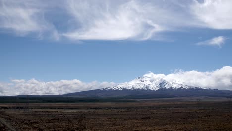 Wide-establishing-shot-of-Mount-Ruapehu-surrounded-by-beautiful-clouds-in-New-Zealand