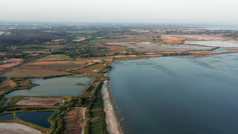 Aerial-drone-footage,-pond-beach-near-Montpellier,-France