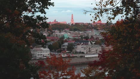 Kaunas-City-Aerial-Timelapse-With-Golden-Autumn-Trees-in-the-Side-of-the-video-and-CHRIST'S-RESURRECTION-Church-in-the-middle-of-the-shot