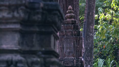 Slider-Shot-Revealing-Khmer-Stone-Face-Carvings-Near-Angkor-Wat