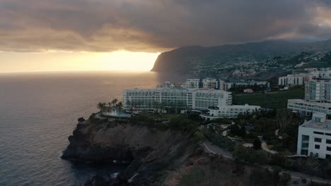 Aerial-sunset-over-Funchal,-Madeira-with-hotels-and-the-ocean