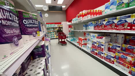 Woman-shopping-for-the-best-deal-on-toilet-paper-at-Target