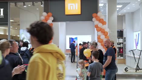 Opening-new-xiaomi-store,-people-are-waiting-in-a-long-line