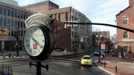 Downtown-Lancaster-clock-city-center,-turn-reveals-Visitors-Center,-Central-Market