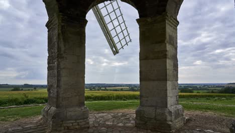 Chesterton-Windmill-timelapse,-view-of-the-Warwickshire-countryside-from-under-the-arches-of-the-old-mill