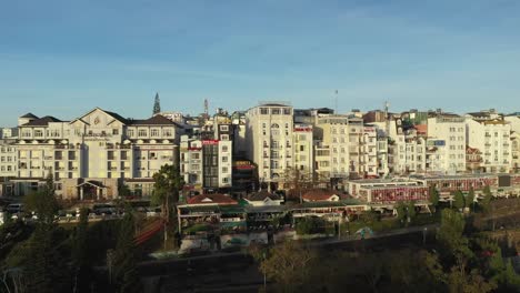 Drone-shot-of-key-buildings-in-city-center-of-Da-Lat-or-Dalat-in-the-Central-Highlands-of-Vietnam-on-sunny-day