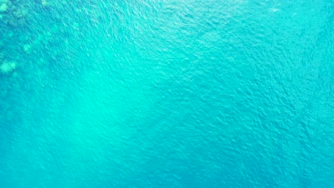 Aquamarine-sea-water-texture-with-sun-reflection