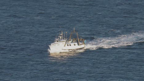 Stern-trawler-fishing-boat-on-blue-sea,-mediterranean,-high-angle