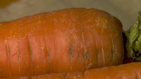 Crunchy,-crispy,-whole,-ripe-carrots-waiting-to-be-peeled