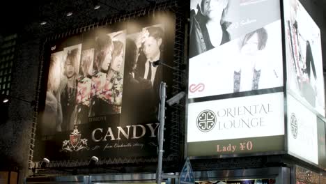 Oriental-Lounge-and-Candy-lounge-in-Shibuya-billboards,-dating-lounges-for-single-women-free-and-paying-men,-Handheld-shot