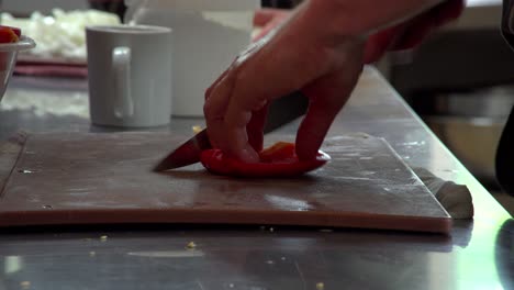 A-chef-slices-peppers-in-both-directions-to-make-small-chunks