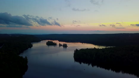 Aerial-view-of-a-picturesque,-calm-lake-at-sunset