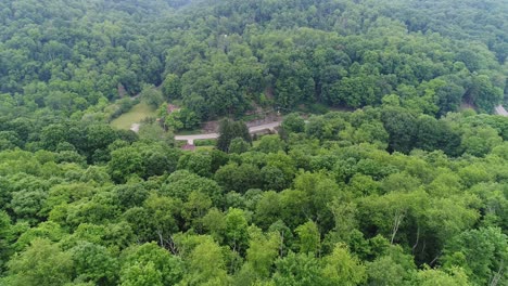 A-slow-forward-aerial-establishing-shot-of-the-Pennsylvania-wooded-countryside