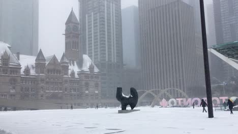 Snowstorm-covers-Nathan-Phillips-Square-with-heavy-amounts-of-snow,-Toronto