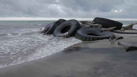 Giant-tires-on-the-beach-orbit-shot