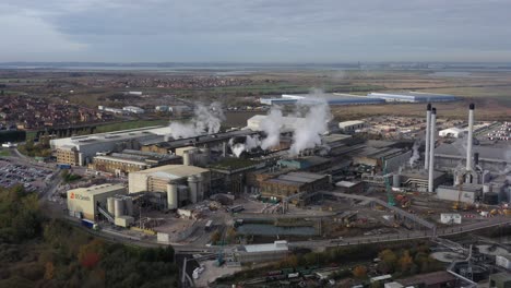 Wide-aerial-view-orbiting-DS-Smith,-Kemsley-paper-mill-in-Kent,-UK