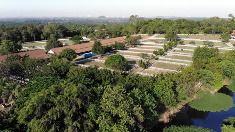 Aerial-over-an-equestrian-center-in-the-beautiful,-lush-countryside-in-Thailand