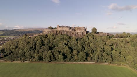 Aerial-crane-shot-up-and-above-Stirling-Castle-looking-North-towards-the-hills-on-a-clear-and-sunny-day