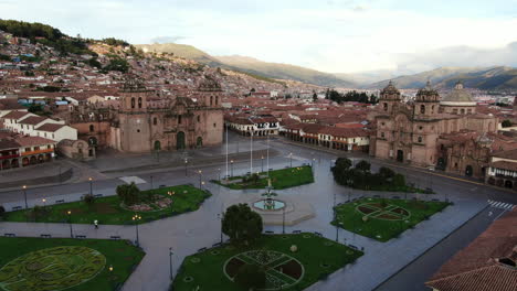 Daytime-4k-aerial-footage-of-Plaza-de-Armas-in-Cusco-City,-Peru-during-Coronavirus-quarantine,-left-to-right-truck-and-pan,-wide-angle-shot