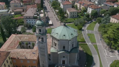 Beautiful-drone-view-of-a-church-in-the-center-of-Riva-Del-Garda,-a-small-city-in-the-region-of-Trentino-in-North-Italy,-Aearial-drone-view