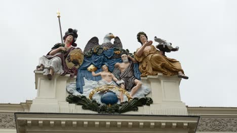 Close-up-shot-of-monument-statues-on-dutch-old-building-in-Alkmaar,Netherlands