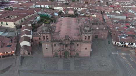 4k-daytime-aerial-drone-footage-revealing-the-main-Cathedral-from-Plaza-de-Armas-in-Cusco,-Peru-during-Coronavirus-lockdown