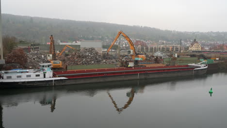 Liebherr--excavators-loading-ship-with-scrap-metal