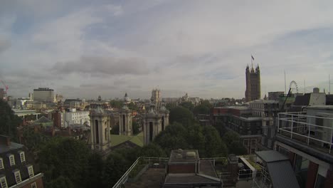 Rooftop-Time-Lapse-Over-Westminster,-London-With-Clouds-Going-Past-Against-Blue-Skies
