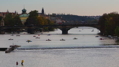 Small-tourist-boats-canoe-swim-in-the-Vltava-River-in-Prague-Czech-Republic