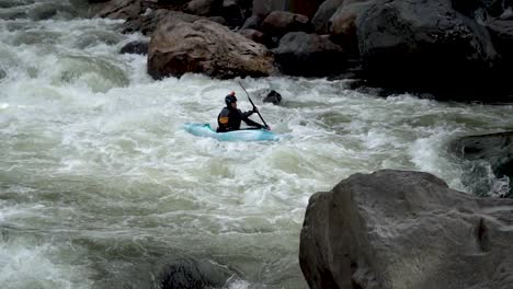 Slow-Motion-of-Kayaker-Fighting-Rapids-downriver-in-Ecuador-to-be-Flipped-after-Hitting-a-Boulder
