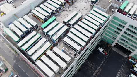 Hong-Kong-multilevel-double-decker-Citybus-depot-and-terminal-in-downtown-Hong-Kong,-Aerial-view