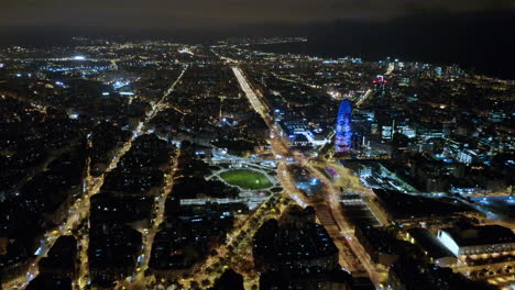 Aerial-shot-of-Plaça-de-les-Glories-Catalanes-at-night,-Barcelona,-Spain