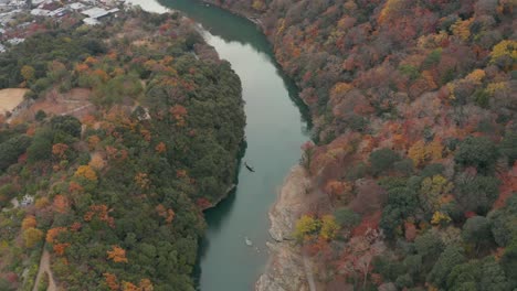 Tranquil-Autumn-scene-in-Japan,-Arashiyama-mountain-aerial-on-outside-of-Kyoto