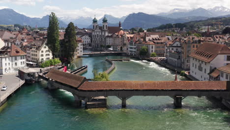 Flying-over-historic-bridge-over-canal-in-Luzern-Switzerland