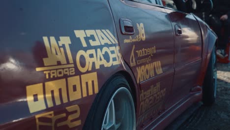 Close-slow-motion-pan-of-logos-on-a-drift-racing-car