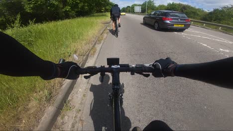 POV-Of-Cyclists-Riding-Along-Edgware-Way-A41-With-Traffic-Going-Past