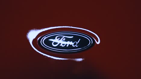 Blue-Ford-Oval-Emblem-on-a-Red-Ford-GT-GT3-Super-Car