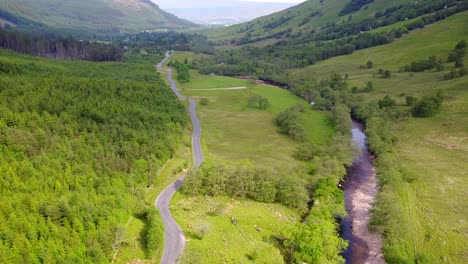 Aerial-Footage-of-Glen-Nevis-road-and-river-in-Scotland